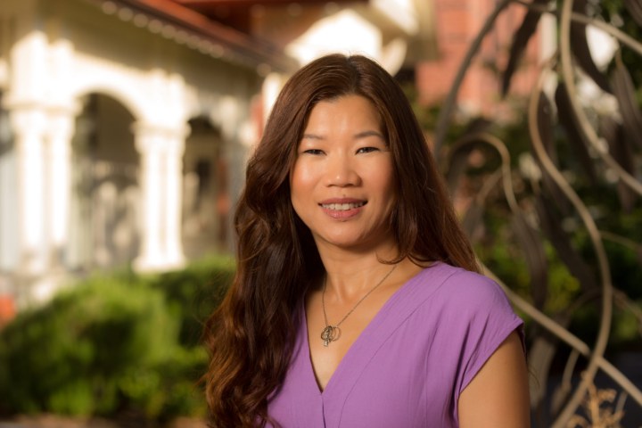 Female school teacher wearing a purple blouse